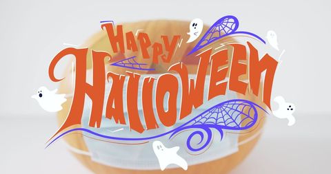 Happy Halloween Text on Pumpkin with Face Mask