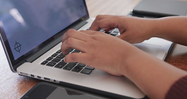 Hands Typing on Laptop with Smartphone on Wooden Desk - Download Free Stock Images Pikwizard.com