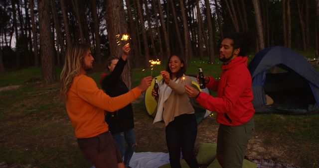 Friends Celebrating with Sparklers in Forest Camping - Download Free Stock Images Pikwizard.com