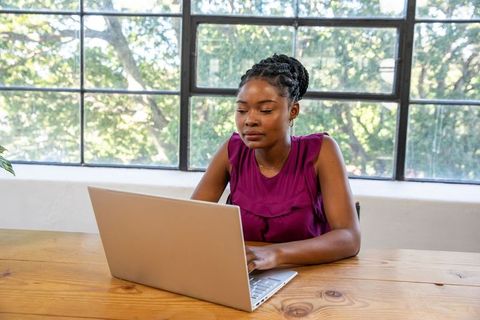 Focused African American Woman Working at Home Office