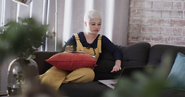 Young Woman Relaxing on Couch with Laptop at Home - Download Free Stock Images Pikwizard.com