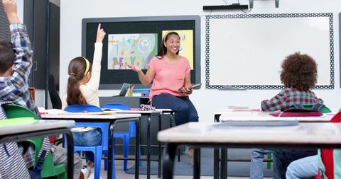 Teacher Engaging Students in Interactive Classroom Discussion - Download Free Stock Images Pikwizard.com