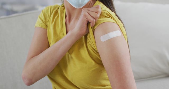 Person Showing Bandage After Vaccination on Arm - Download Free Stock Images Pikwizard.com