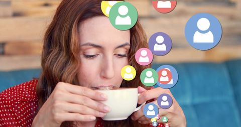 Woman Engaging with Social Media While Relaxing with Coffee