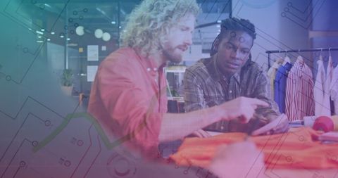 Diverse entrepreneurs analyzing financial tech data in modern workspace