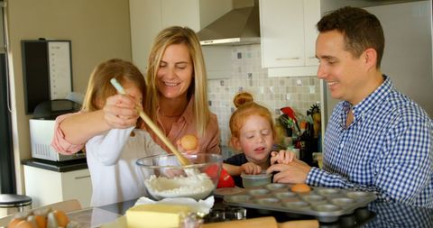 Family Bonding While Baking Together in Kitchen