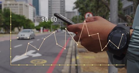 Digital business analytics on smartphone outdoors