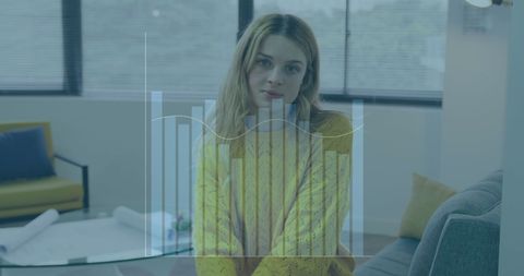 Businesswoman Analyzing Financial Data with Bar Graph Overlay