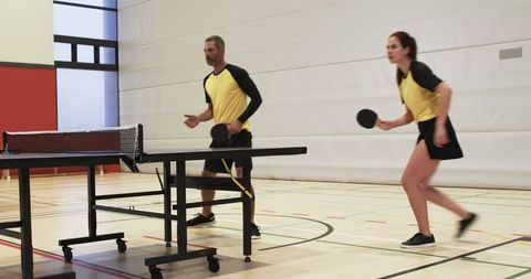 Team Practicing Table Tennis with Intensity