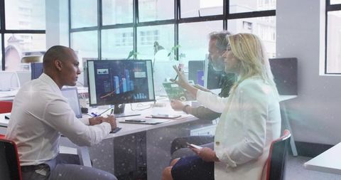 Business Team Collaborating on Data Analysis in Office