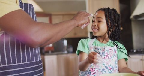 Father and Daughter Bonding in Kitchen with Flour Play