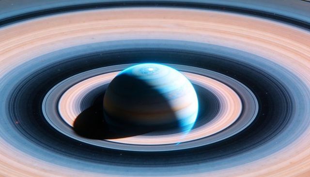 Azure-Beige Ringed Gas Giant Casting Deep Shadow over Crescent Moon and Swirling Vortex