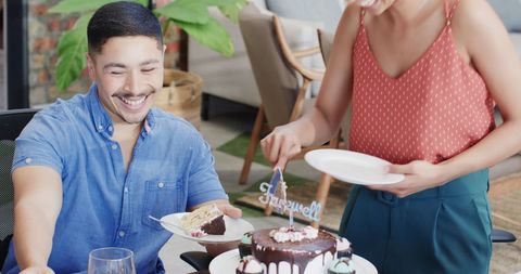 Colleagues Celebrating Farewell Party with Cake in Office Environment