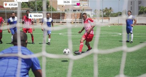 Striker kicking ball toward goal while goalkeeper defending with social media overlay