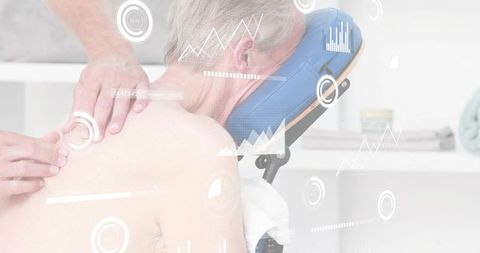 Senior receiving therapeutic back massage with digital health data visualization overlay