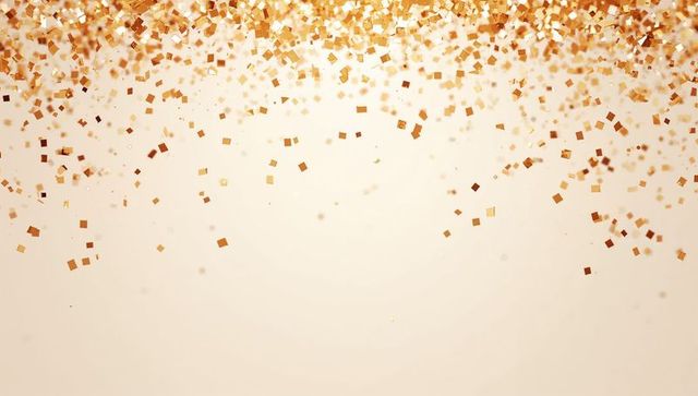 Gold metallic confetti shower over soft beige backdrop for celebration and luxury