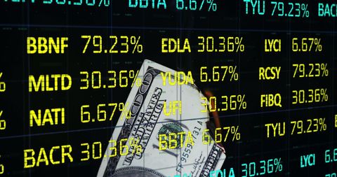 Burning Dollar Against Stock Market Data Background