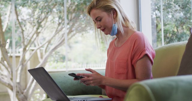 Young Woman Working from Home with Laptop and Smartphone - Download Free Stock Images Pikwizard.com