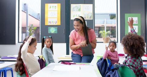 Energetic Teacher Interacting with Diverse Students in Classroom - Download Free Stock Images Pikwizard.com