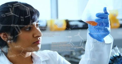 Female scientist inspecting orange solution in conical flask with molecular overlays