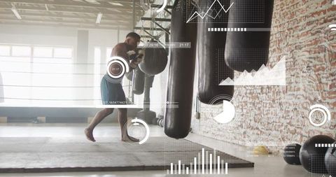 Shirtless boxer training on heavy bag with fitness analytics overlay in industrial gym