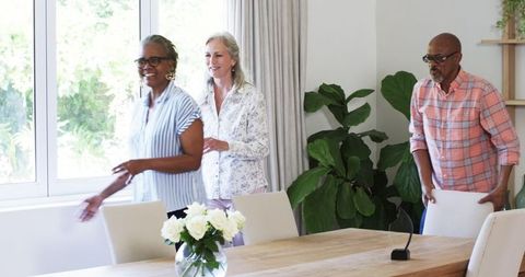 Seniors Decorating Living Room for Retirement Party Gathering
