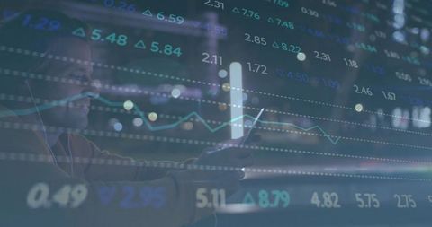 Businessman Analyzing Financial Data on Smartphone at Night