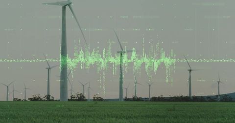 Wind turbines on grassy fields with digital data overlay