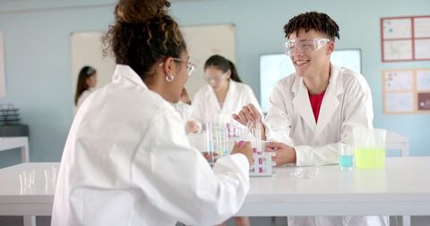 engaged high school students conducting science experiment in lab - Download Free Stock Images Pikwizard.com