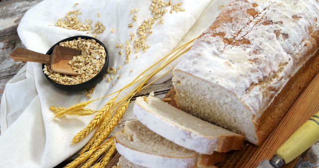 Freshly Sliced Homemade Bread and Wheat Grains on Rustic Table - Download Free Stock Images Pikwizard.com