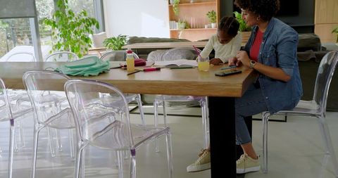 Mother and Daughter Bonding at Home Over Schoolwork