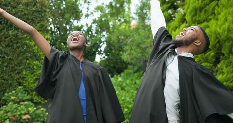 Graduating Students Joyfully Celebrating Success Outdoors