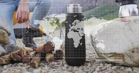 Adventurous coffee preparation in wilderness with world map overlay