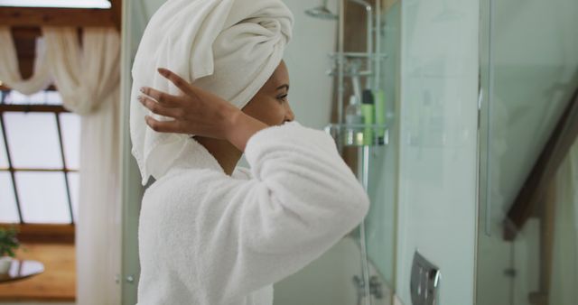 Smiling Woman in Bathrobe and Towel Turban in Bathroom - Download Free Stock Images Pikwizard.com