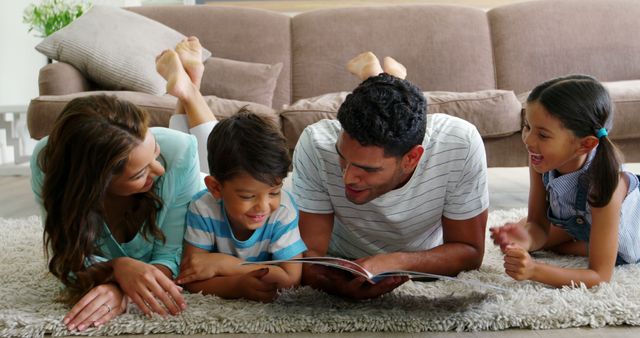 Happy Family Reading Book Together on Living Room Floor - Download Free Stock Images Pikwizard.com