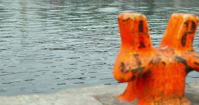 Close-Up of Orange Bollard by Water - Download Free Stock Images Pikwizard.com