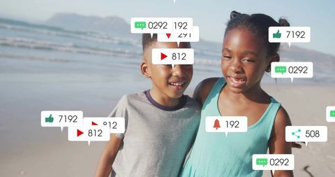 Happy siblings on beach with social media engagement