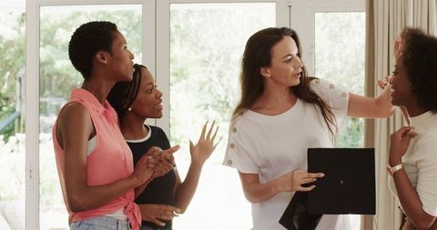 Diverse women collaborating creatively at home