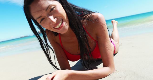 Portrait of young woman lying on the beach 4k - Download Free Stock Photos Pikwizard.com