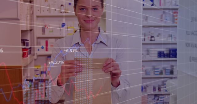 Smiling Pharmacist Analyzes Data in Bright Pharmacy - Download Free Stock Images Pikwizard.com