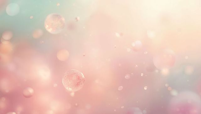Floating Translucent Spheres Over Pastel Peach Pink Teal Bokeh with Glittering Particles