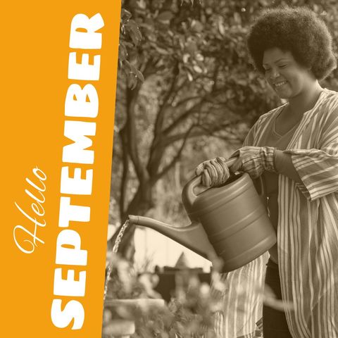 Joyful woman watering plants in autumn garden