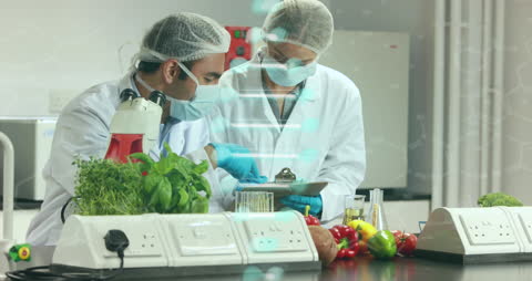 Diverse Scientists Analyzing Data in Laboratory with DNA Animation