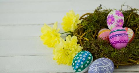 Colorful Easter Eggs in Nest with Yellow Flowers on White Background - Download Free Stock Images Pikwizard.com