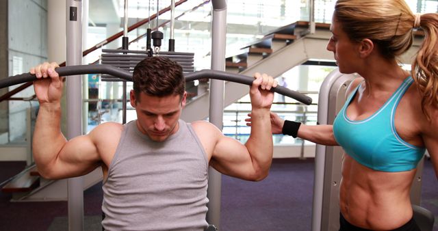 Fitness Instructor Assisting Man with Strength Training - Download Free Stock Images Pikwizard.com