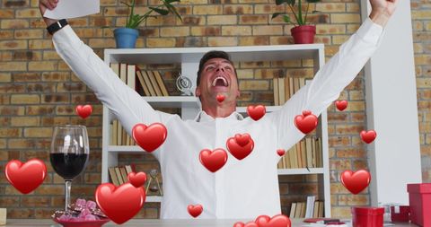 Joyful Man Surrounded by Animated Hearts in Office Setting