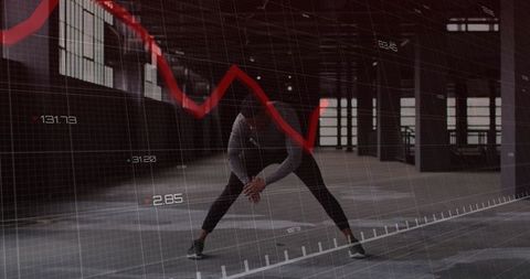 Athlete stretching in industrial space with digital chart overlay