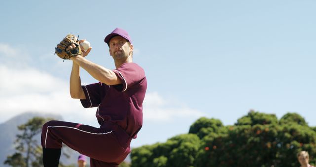 Baseball Pitcher About to Throw Ball During Sunny Day at Outdoor Field - Download Free Stock Images Pikwizard.com