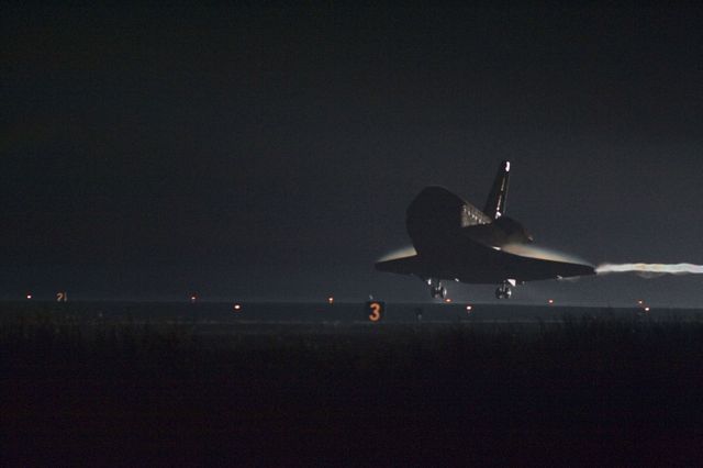 Space shuttle Endeavour lands at night on Runway 15 at Kennedy Space Center for final time on June 1, 2011. Ideal for usage in aerospace and space exploration articles, educational materials, history of space missions, and documentaries about NASA's space shuttle program. Useful in commemorating Endeavour's last journey and its contributions to space research.