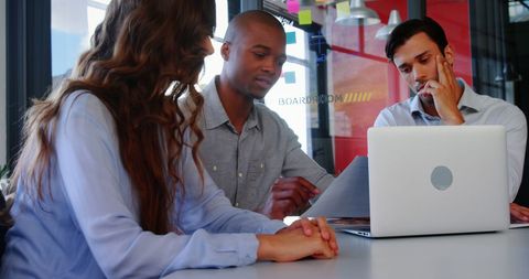 Diverse Business Executives Collaborating in Modern Office Meeting